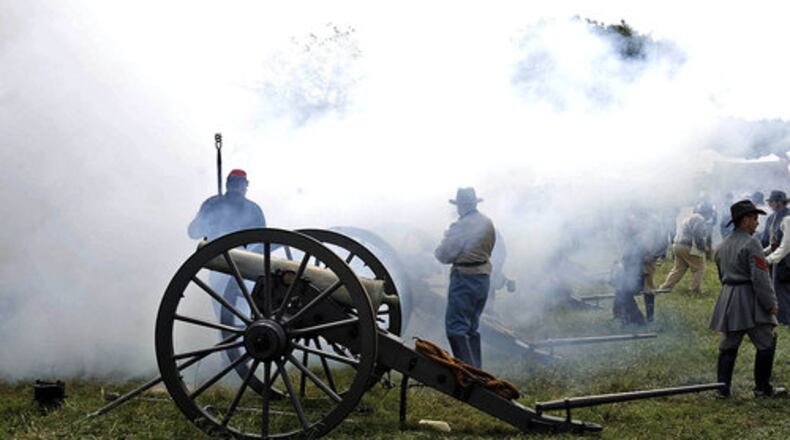 Smoke fills the air after a cannon is fired.