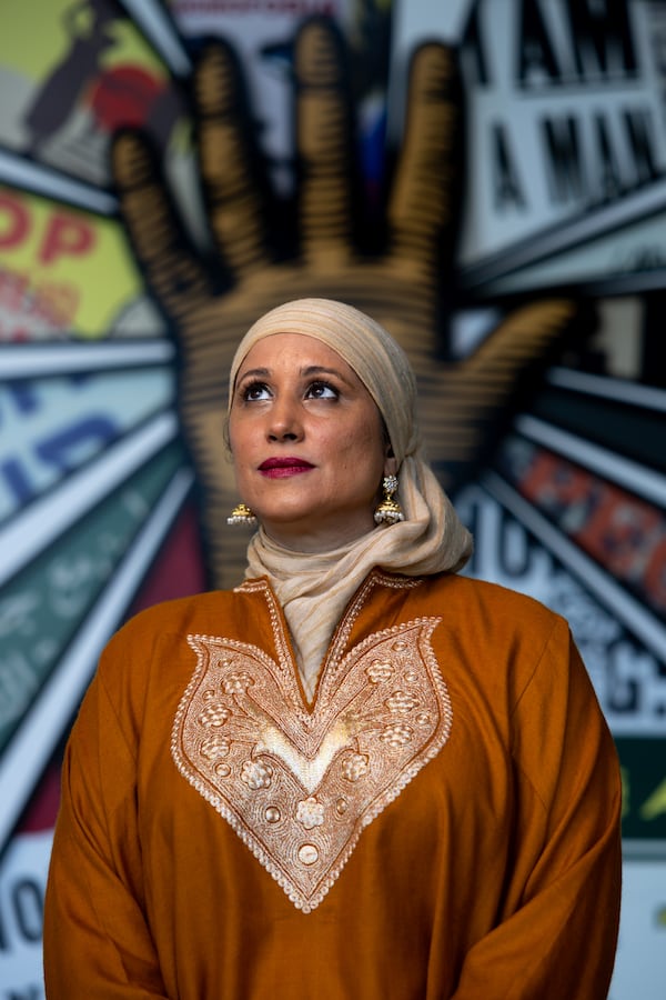 Sameera Fazili, 47, wears a pheran at the National Center for Civil and Human Rights in Atlanta. (Arvin Temkar/AJC)