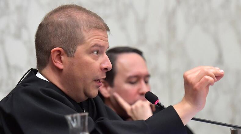 Justice Nels Peterson asks question during recent arguments before the Georgia Supreme Court. (HYOSUB SHIN / HSHIN@AJC.COM)