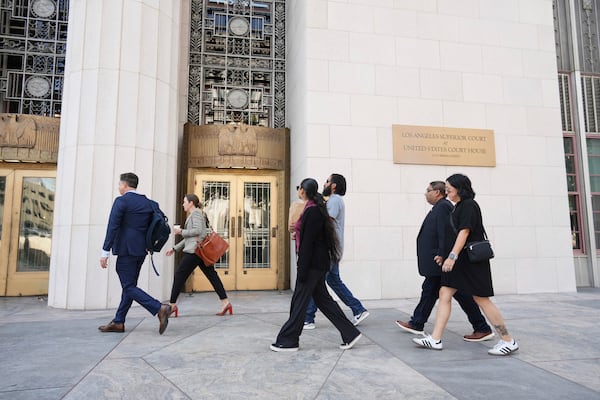 Plantiffs and their lawyers arrive for a court hearing in a lawsuit between victims' families in the 2022 Uvalde, Texas school shooting and Meta Platforms on Friday, July 18, 2025, in Los Angeles. (AP Photo/Eric Thayer)