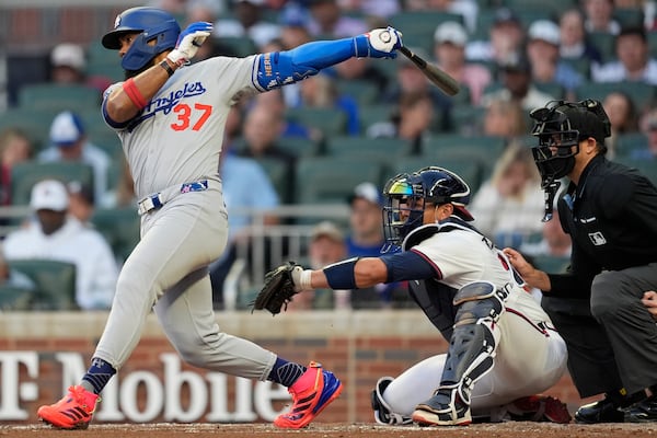 Los Angeles Dodgers outfielder Teoscar Hernández (37) hits a single against the Atlanta Braves in the third inning of a baseball game, Sunday, May 4, 2025, in Atlanta. (AP Photo/Mike Stewart)