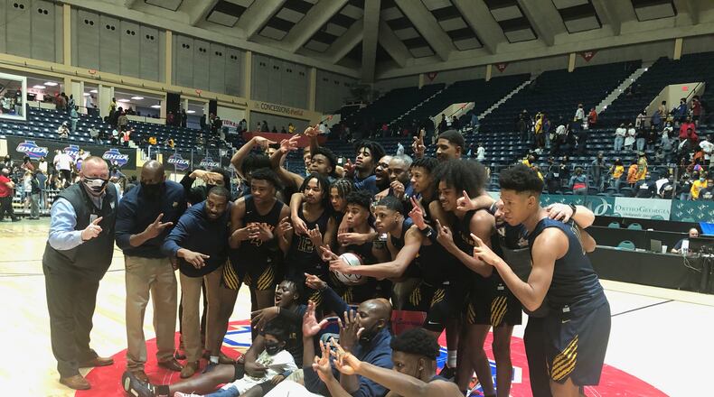The Wheeler boys celebrate winning the 2021 Class 6A championship over rival Kell on March 12, 2021.