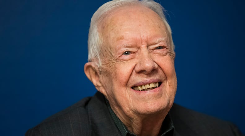 Former U.S. President Jimmy Carter smiles during a book signing event for his new book 'Faith: A Journey For All' at Barnes & Noble bookstore in Midtown Manhattan, March 26, 2018 in New York City. Carter, 93, has been a prolific author since leaving office in 1981, publishing dozens of books. (Photo by Drew Angerer/Getty Images)