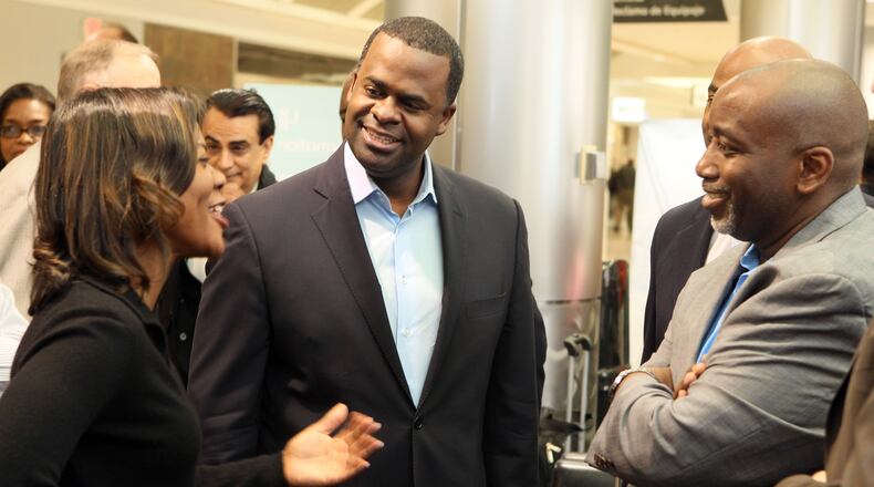 (left to right) Chief of Staff Candance Byrd, Mayor Kasim Reed and councilman H. Lamar Willis chat at Hartsfield-Jackson Atlanta International Airport, International Terminal E in Atlanta before embarking to China on a trade mission on Friday Mar. 23, 2012. For story examining the last-minute plans the Mayor's trade mission to China. He is bringing about a third of the City Council with him.