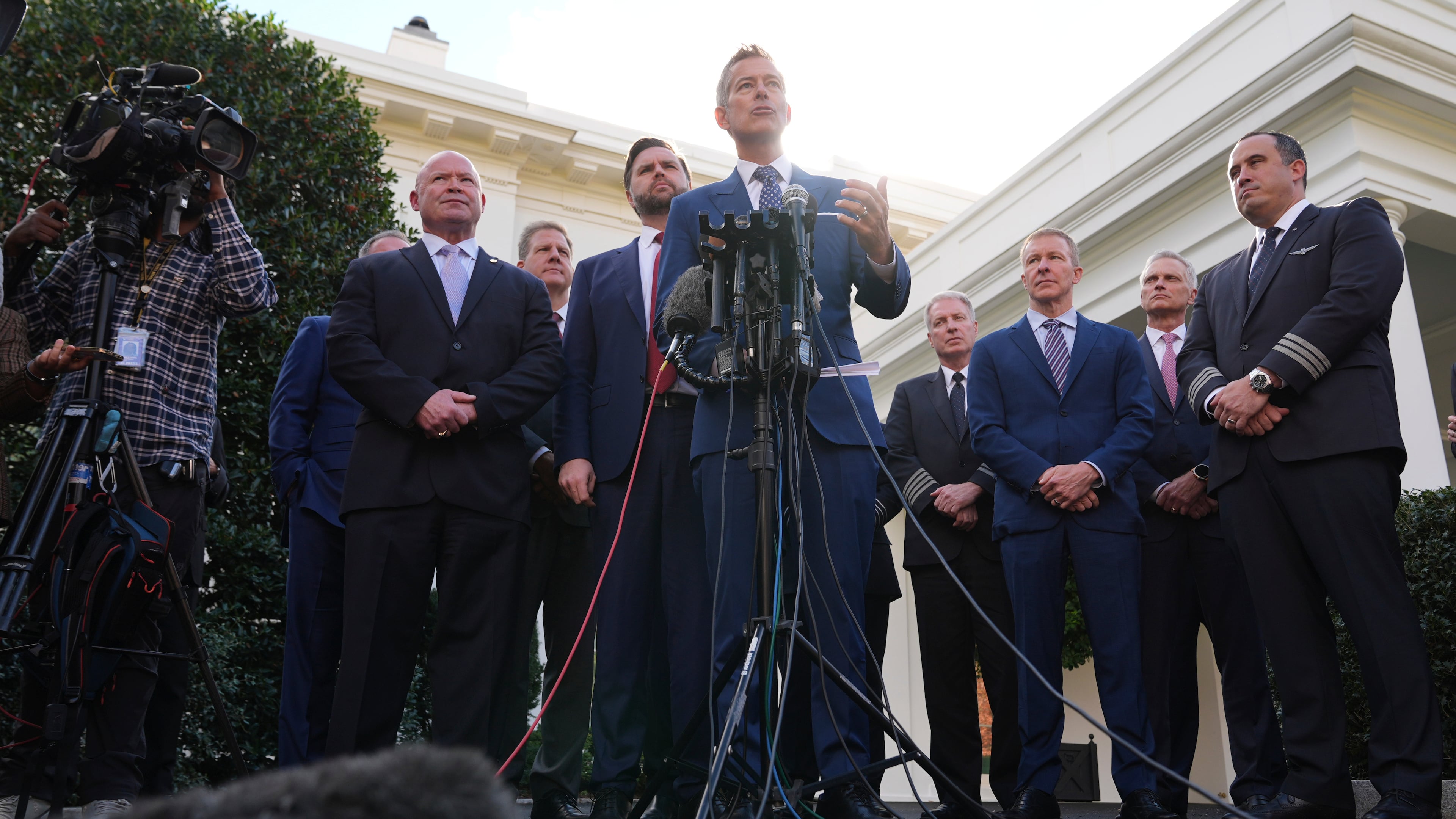 Transportation Secretary Sean Duffy speaks to the media alongside Sean O'Brien, President of the International Brotherhood of Teamsters, from left, Chris Sununu, president & CEO of Airlines for America, Vice President JD Vance and aviation industry representatives, about the impact of the government shutdown on the aviation industry, outside of the West Wing of the White House, Thursday, Oct. 30, 2025, in Washington. (AP Photo/Jacquelyn Martin)