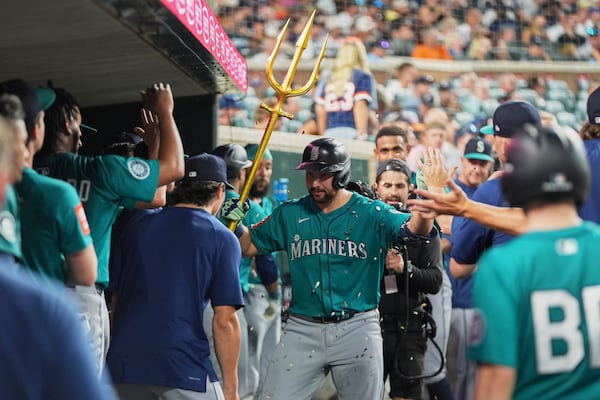Seattle Mariners catcher Cal Raleigh celebrates his home run against the Detroit Tigers in the eighth inning during a baseball game, Friday, July 11, 2025, in Detroit. (AP Photo/Paul Sancya)