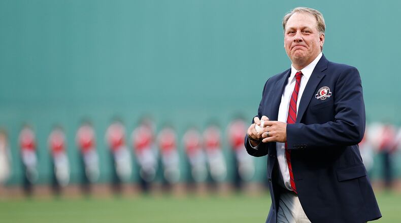 BOSTON, MA - AUGUST 03: Former Boston Red Sox pitcher Curt Schilling #38 throws out the first pitch after being inducted into the Red Sox Hall of Fame prior to the game against the Minnesota Twins during the game on August 3, 2012 at Fenway Park in Boston, Massachusetts. (Photo by Jared Wickerham/Getty Images)