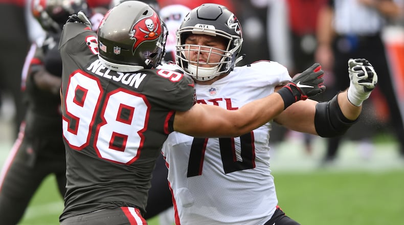 Atlanta Falcons offensive tackle Jake Matthews (70) works against Tampa Bay Buccaneers linebacker Anthony Nelson (98) Sunday, Jan. 3, 2021, in Tampa, Fla. (Jason Behnken/AP)