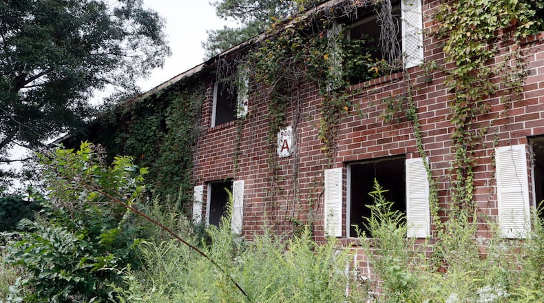9/5/18 - Atlanta - Most of the windows were broken out of the blighted apartments and they were filled with trash. Then- Mayor Keisha Lance Bottoms, Councilmember Dustin Hillis, District 9, and Councilmember Andrea Boone, District 10, were on hand for the launch of the next phase of the mayor's "Fight the Blight" initiative with the demolition of several blighted apartments on Bolton Road. BOB ANDRES /BANDRES@AJC.COM