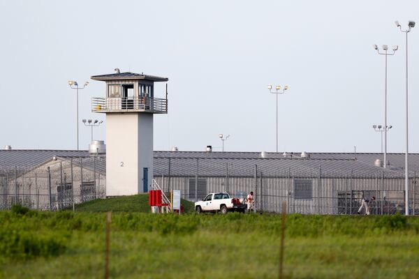 FILE - An inmate works outdoors during the hot summer outside a Texas prison unit in Huntsville, Texas, on June 25, 2015. (Rose Baca/The Dallas Morning News via AP, File)