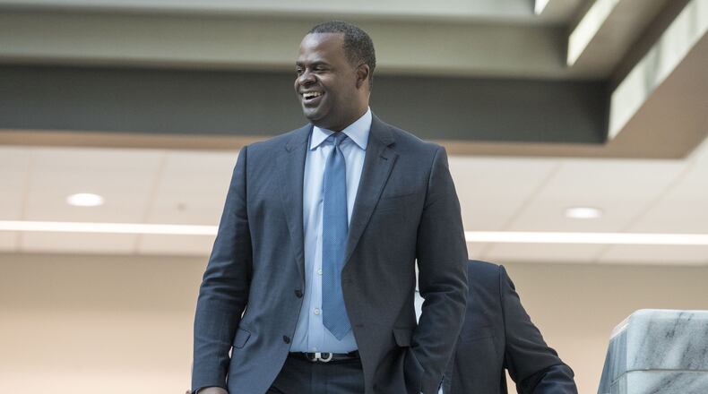 12/29/2017 — Atlanta, GA, - Atlanta mayor Kasim Reed smiles as people gathered in the atrium of Atlanta City Hall applaud him during his final workday as mayor of Atlanta, Friday, December 29, 2017. In addition to unveiling last minute decisions that he oversaw during his time as mayor of Atlanta, Kasim Reed also celebrated with food and a live dj in the auditorium of the building. ALYSSA POINTER/ALYSSA.POINTER@AJC.COM
