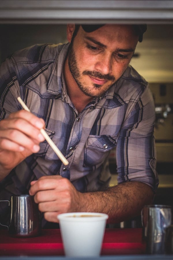 Refuge Coffee in Clarkston is a welcoming place for refugees to relax and meet with friends. Refuge helps provide job training and mentoring to resettled refugees and other immigrants. (Photo by Sean Sheridan)