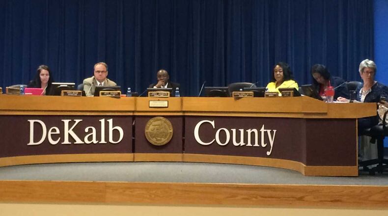 The DeKalb Board of Commissioners is considering whether to hold one monthly meeting at 5 p.m. The commission is pictured here at its May 17 meeting. MARK NIESSE / MARK.NIESSE@AJC.COM