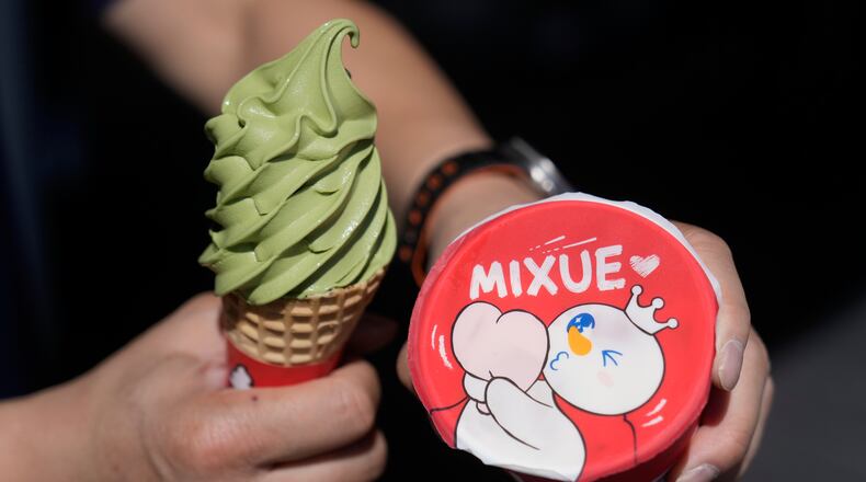 A customer holds an ice cream cone outside of a Mixue store, Wednesday, Sept. 16, 2026, in Sunnyvale, Calif. (AP Photo/Jeff Chiu)