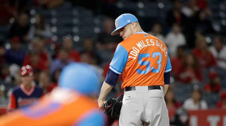 Houston Astros relief pitcher Ken Giles looks at first base during the ninth inning of a baseball game against the Los Angeles Angels, Friday, Aug. 25, 2017, in Anaheim, Calif. The Astros won 2-1. (AP Photo/Jae C. Hong)