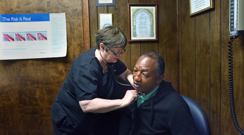 Dr. Karen Kinsell checks her patient Jimmie Fair at Clay County Medical Center in Fort Gaines on Thursday, October 19, 2017.
