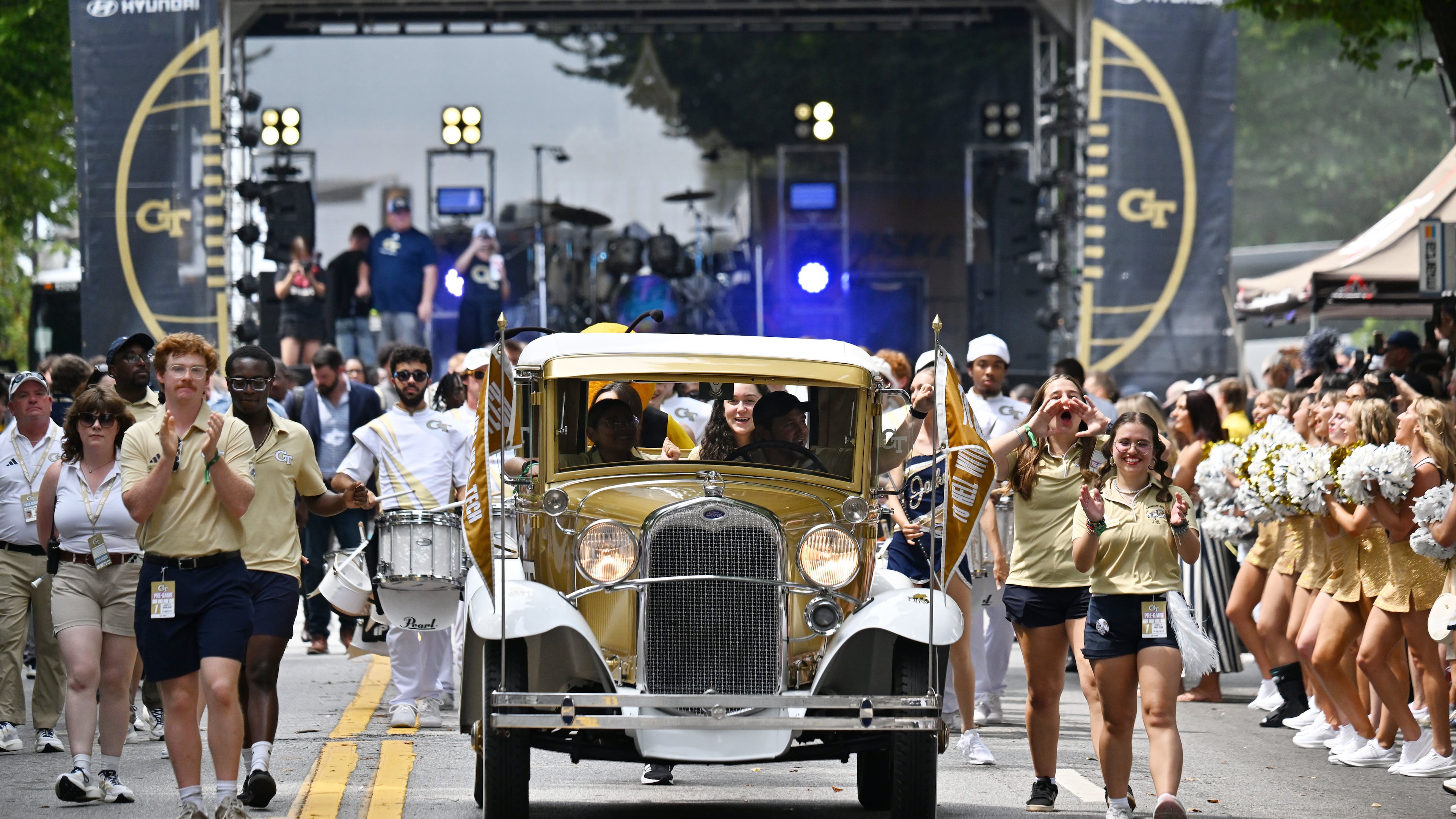 Georgia Tech's Ramblin' Wreck leads the band, cheerleaders, Buzz, players and coaches before the start of the Georgia Tech home opener against Gardner-Webb at Georgia Tech's Bobby Dodd Stadium, on Saturday, Sept. 6, 2025 in Atlanta. (Hyosub Shin / AJC)