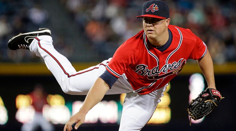 Atlanta Braves starting pitcher Kris Medlen throws in the first inning of a baseball game against the Philadelphia Phillies, Friday, Sept. 27, 2013, in Atlanta.