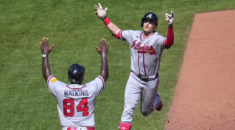 Braves outfielder Mike Yastrzemski (right) celebrates with third base coach Tommy Watkins after hitting a grand slam home run off Pirates pitcher Dennis Santana on Thursday, July 9, 2026, in Pittsburgh. Yastrzemski has been placed on the 10-day injured list. (Gene J. Puskar/AP)