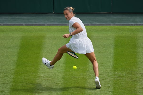 Aryna Sabalenka of Belarus plays a return to Coco Gauff of United States during a practice session ahead of the Wimbledon Championships in London, Friday, June 27, 2025. (AP Photo/Kin Cheung)