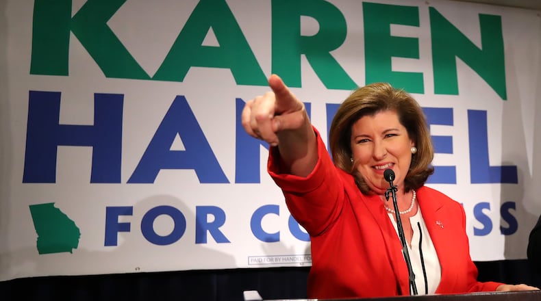 Karen Handel points at her supporters while thanking them during her election night party in the 6th District race with Jon Ossoff on Tuesday. Curtis Compton/ccompton@ajc.com