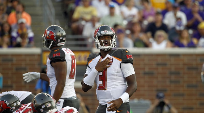 Tampa Bay Buccaneers quarterback Jameis Winston (3) signals at the line of scrimmage against the Minnesota Vikings during the first half of a preseason NFL football game at TCF Bank Stadium Saturday, Aug. 15, 2015, in Minneapolis. (AP Photo/Ann Heisenfelt)