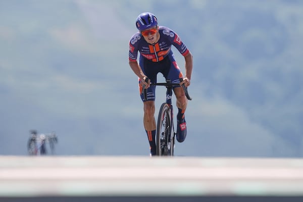Britain's Oscar Onley climbs during the thirteenth stage of the Tour de France cycling race, an individual time-trial over 10.5 kilometers (6.5 miles) in the Pyrenees mountains with start in Loudenvielle and finish in Peyragudes, France, Friday, July 18, 2025. (AP Photo/Thibault Camus)
