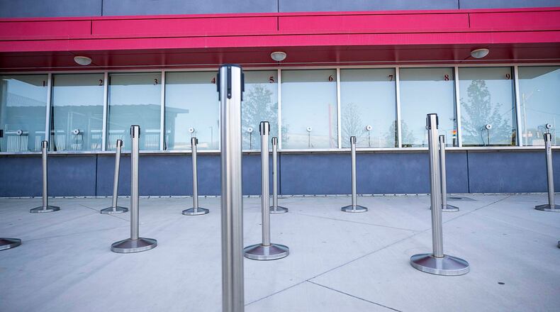 Retractable crowd-control barriers sit unused outside of the ticket office at Mercedes-Benz Stadium.