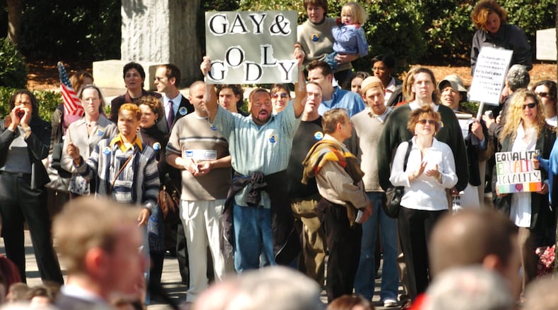In this 2004 file photo, a large crowd protests the state constitutional amendment that would ban gay marriage in Georgia. Supporters of the amendment are in the foreground.