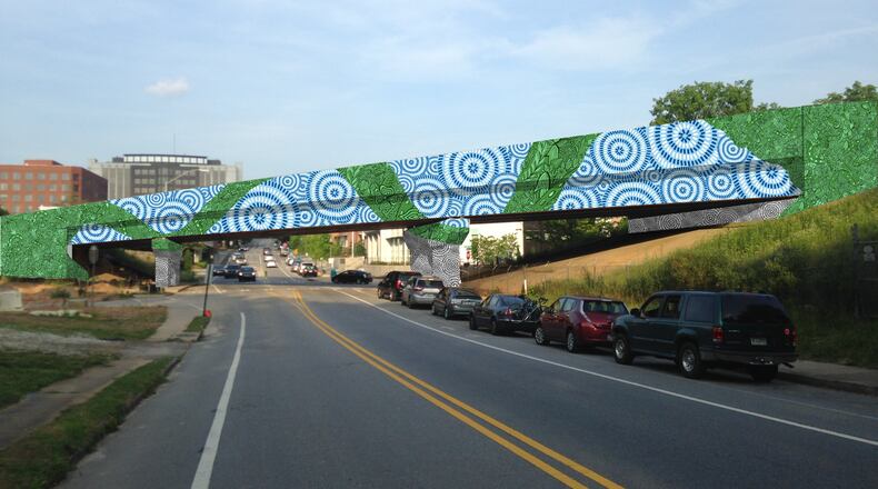This rendering is of the mural for the MARTA overpass at West Trinity Place and Atlanta Avenue in Decatur. Though it’s impossible to see here, on closer inspection the green ribbon becomes a deeply nuanced tapestry of chameleons, caterpillars, snakes, blueberries, salamanders and other local plants and animals. Courtesy of the Decatur Arts Alliance