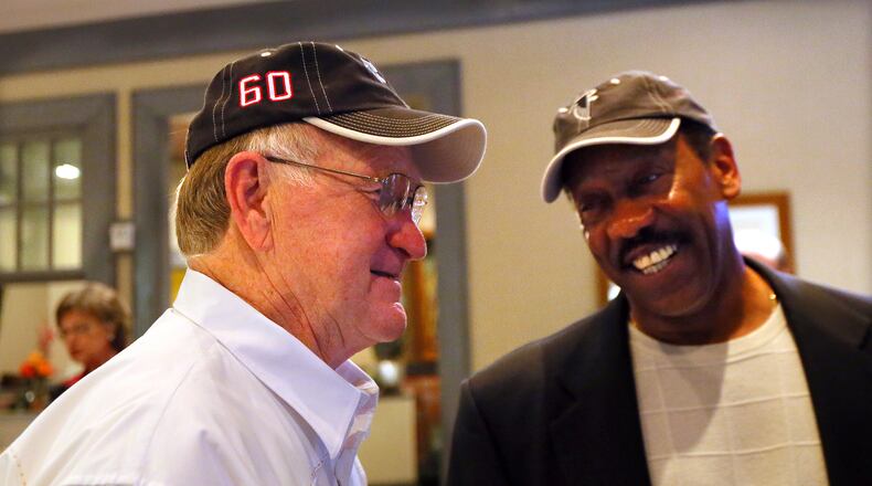 Falcons first-ever draft pick linebacker Tommy Nobis (left) shares a laugh with teammate safety Ray Brown during a reunion on Saturday, May 4, 2013, at Lake Lanier Islands Resort. CURTIS COMPTON / CCOMPTON@AJC.COM