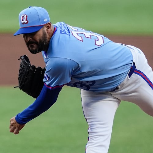 Atlanta Braves pitcher Martín Pérez (33) works against the Cleveland Guardians in the first inning of a baseball game, Saturday, April 11, 2026, in Atlanta. (AP Photo/Mike Stewart)