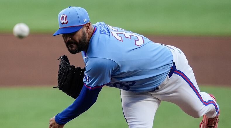 Atlanta Braves pitcher Martín Pérez (33) works against the Cleveland Guardians in the first inning of a baseball game, Saturday, April 11, 2026, in Atlanta. (AP Photo/Mike Stewart)