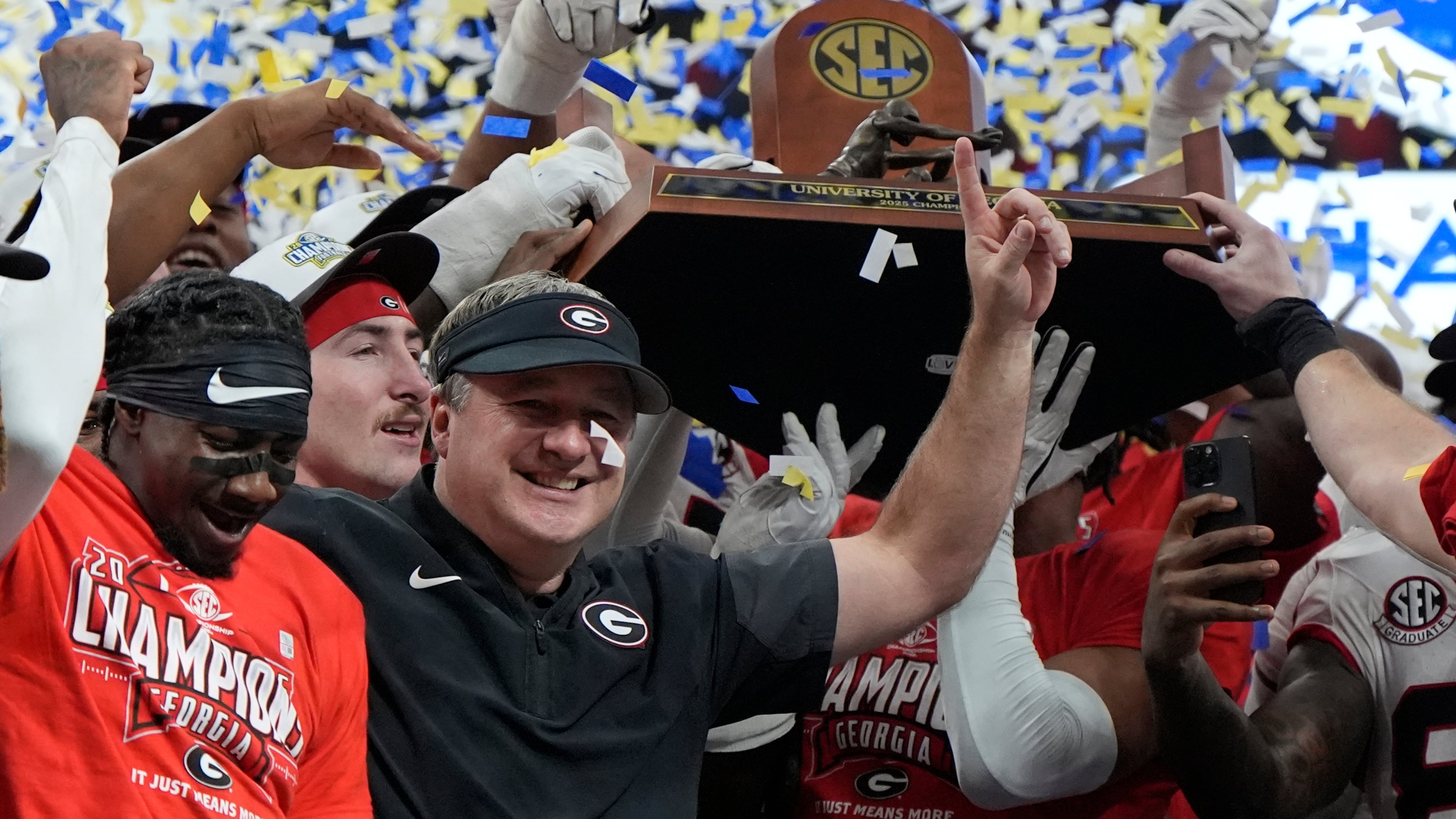 Georgia head coach Kirby Smart and team celebrate after a Southeastern Conference championship NCAA college football game against Alabama, Saturday, Dec. 6, 2025, in Atlanta. (Mike Stewart/AP)