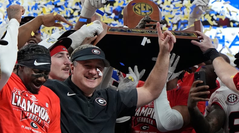 Georgia head coach Kirby Smart and team celebrate after a Southeastern Conference championship NCAA college football game against Alabama, Saturday, Dec. 6, 2025, in Atlanta. (Mike Stewart/AP)
