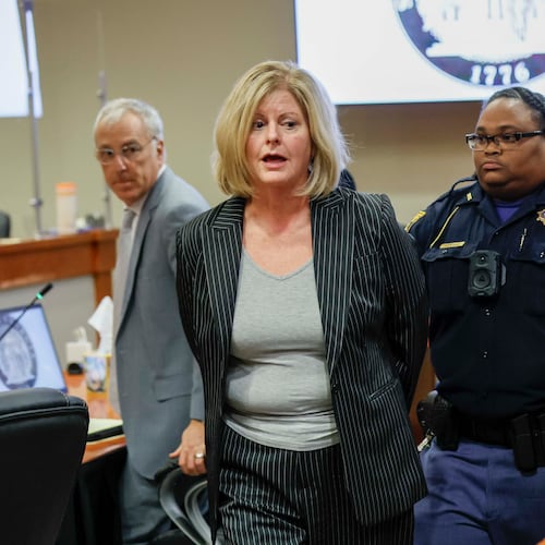 After she was found guilty but before leaving the courtroom, Michelle Wierson turned to Samuel Jenness and Leah Tracosas Jenness and apologized. (Miguel Martinez/AJC)