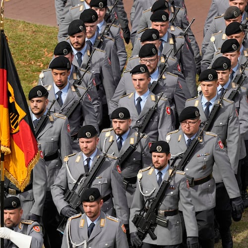 FILE - New recruits of the German Army Bundeswehr attend a ceremony to take their oath in front of the North Rhine-Westphalia state parliament in Duesseldorf, Germany, on Sept. 4, 2025. (AP Photo/Martin Meissner, File)
