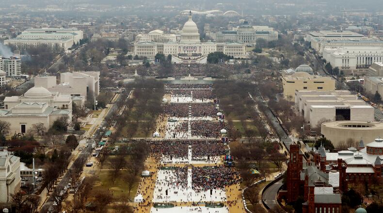 WASHINGTON, DC - JANUARY 20: Attendees line the Mall as they watch ceremonies to swear in Donald Trump on Inauguration Day on January 20, 2017 in Washington, DC. Donald J. Trump will become the 45th president of the United States today. (Photo by Lucas Jackson - Pool/Getty Images)