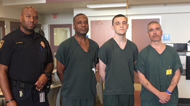 Deputy Gracia (far left) was assisted by Vance Wallace (center left),  Ibrahim Mujic (center right) and Fredrick Huse (far right) while saving another inmate’s life, authorities said.