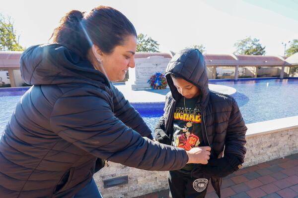 Shayna Sautman (left), 36, and her 8-year-old son, Justice Sautman, visit the King Center at the Martin Luther King Jr. National Historic Site on Sunday, Jan. 18, 2026. (Miguel Martinez/AJC)