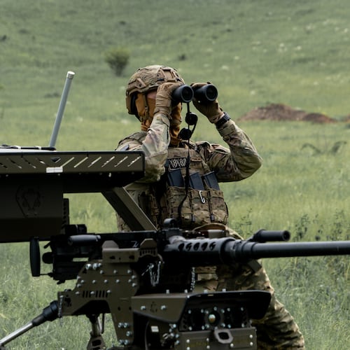 A Ukrainian serviceman of the Cerberus Ground Unmanned Systems Company of the 60th Separate Mechanized Brigade, Third Army Corps, conducts a drill with a combat ground drone during a training at the polygon in Kharkiv region, Ukraine, Sunday, May 24, 2026. (AP Photo/Andrii Marienko)