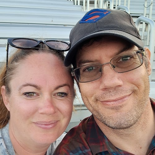This undated photo provided by Rebecca Rischar on Wednesday, June 17, 2026, shows her, left, posing for a photo with her husband Christopher Rischar. (Rebecca Rischar via AP)