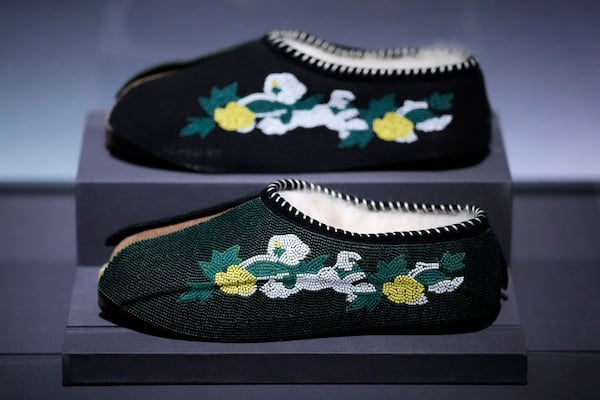 Slippers designed by Tremaine Emory for Denim Tears are displayed at the Metropolitan Museum of Art's Costume Institute exhibition, "Superfine: Tailoring Black Style," on Saturday, May 3, 2025, in New York. (Photo by Charles Sykes/Invision/AP)