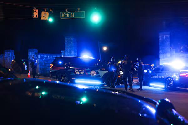 Atlanta police respond to a scene near a Piedmont Park entrance on 10th Street late Saturday, April 4, 2026. (Arvin Temkar / AJC)