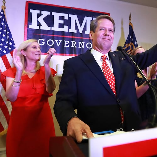Then-Secretary of State Brian Kemp, backed by his wife Marty, gives his victory speech in the GOP runoff election at the Holiday Inn on Tuesday, July 24, 2018, in Athens. (Curtis Compton/AJC)