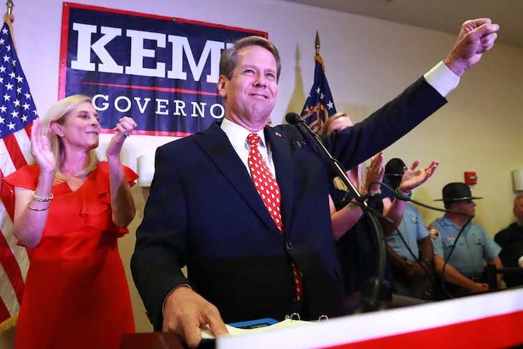 Then-Secretary of State Brian Kemp, backed by his wife Marty, gives his victory speech in the GOP runoff election at the Holiday Inn on Tuesday, July 24, 2018, in Athens. (Curtis Compton/AJC)