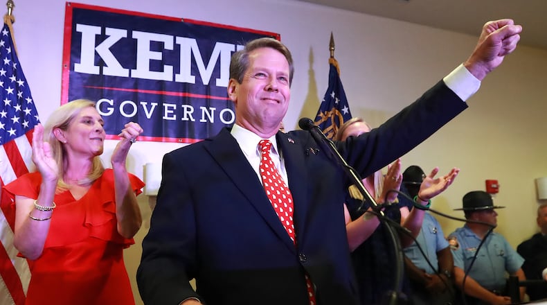 Then-Secretary of State Brian Kemp, backed by his wife Marty, gives his victory speech in the GOP runoff election at the Holiday Inn on Tuesday, July 24, 2018, in Athens. (Curtis Compton/AJC)