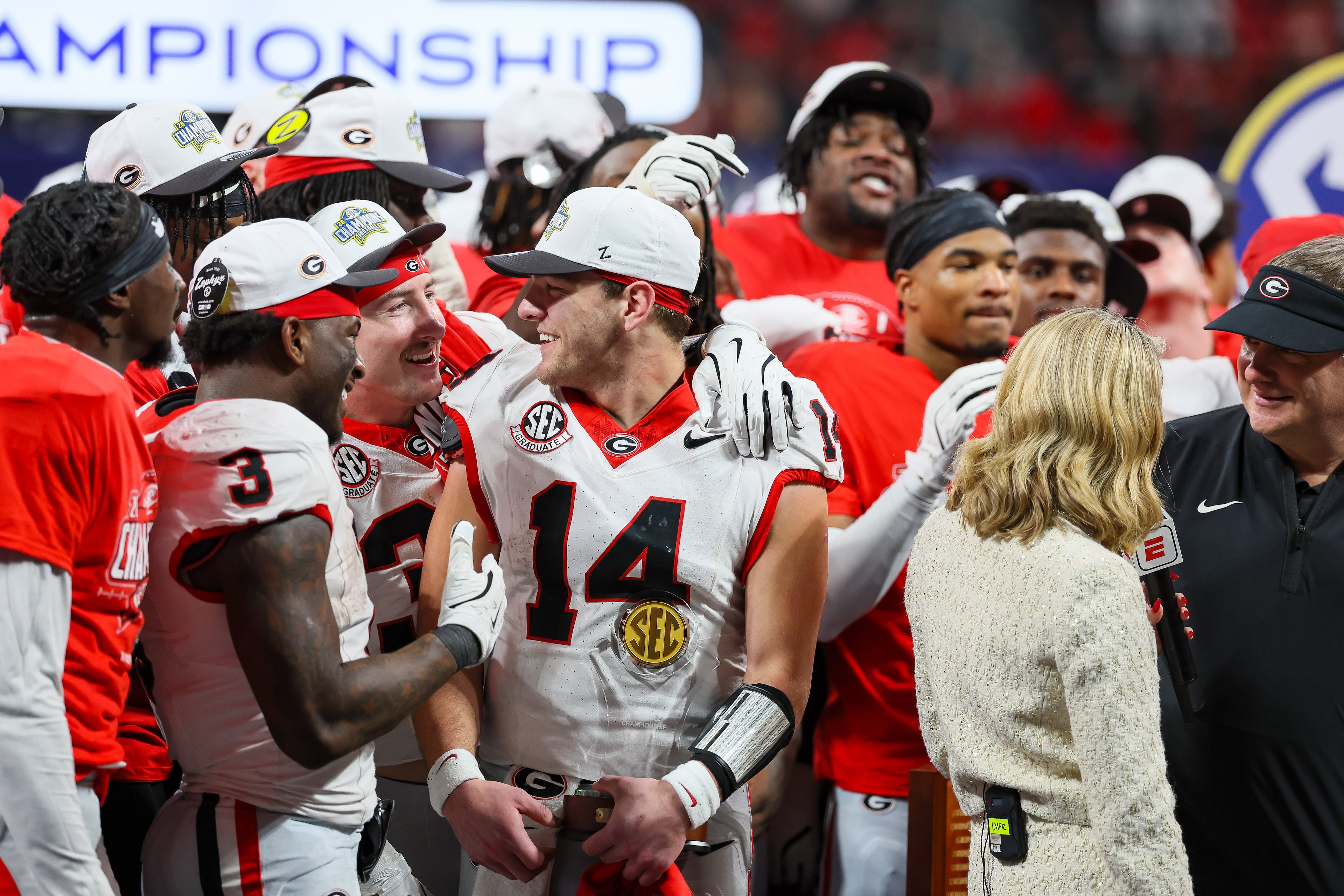 Georgia quarterback Gunner Stockton (14) celebrates a 28-7 victory over Alabama in the SEC Championship game at Mercedes-Benz Stadium, Saturday, Dec. 6, 2025, in Atlanta. (Jason Getz / AJC)