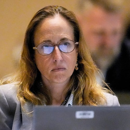 FILE - Dr. Tracy Beth Hoeg, with the FDA, listens during a meeting of the Advisory Committee in Immunization Practices at the CDC, June 25, 2025, in Atlanta. (AP Photo/Mike Stewart, File)
