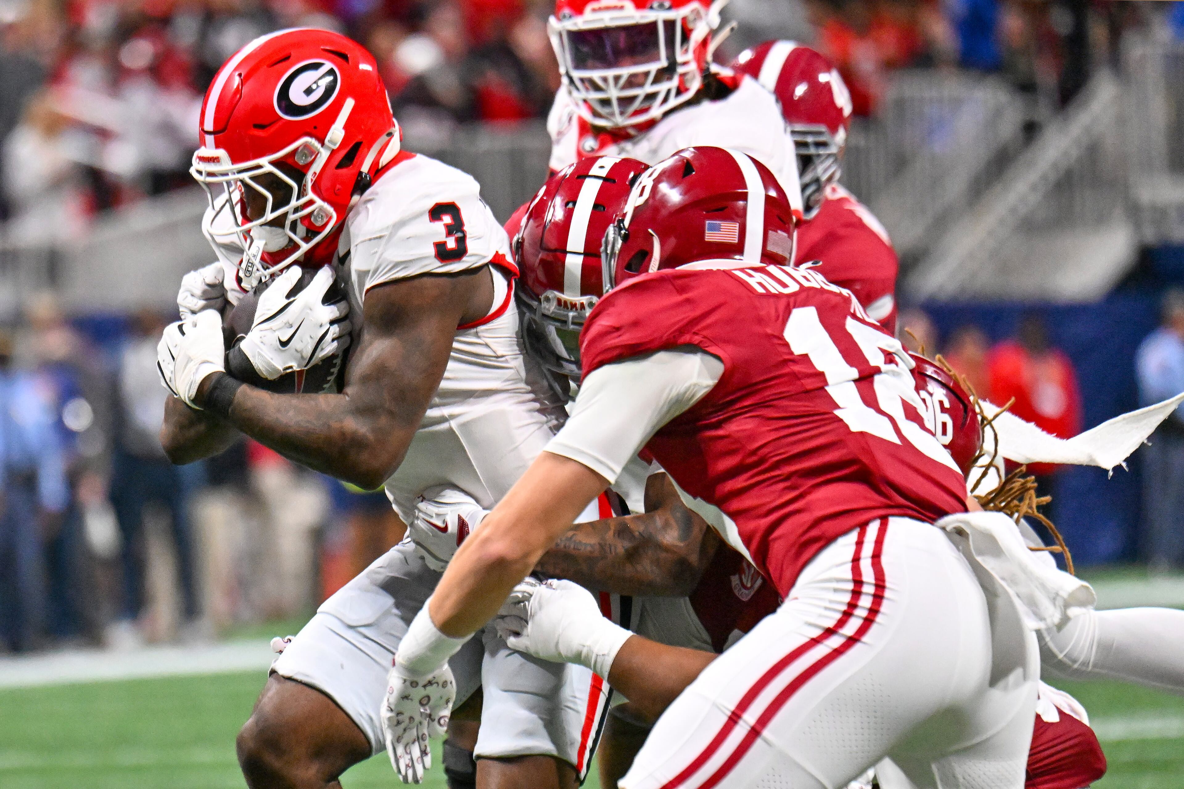Georgia running back Nate Frazier (3) rushes against Alabama defensive back Bray Hubbard (18) during the first quarter of the SEC Championship game at Mercedes-Benz Stadium, Saturday, Dec. 6, 2025, in Atlanta. (Hyosub Shin / AJC)